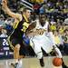 Michigan junior Tim Hardaway Jr. moves the ball around Iowa senior Eric May during the first half against Iowa at Crisler Center on Sunday, Jan. 6. Michigan beat Iowa 95-67 in the Big Ten home opener. Melanie Maxwell I AnnArbor.com